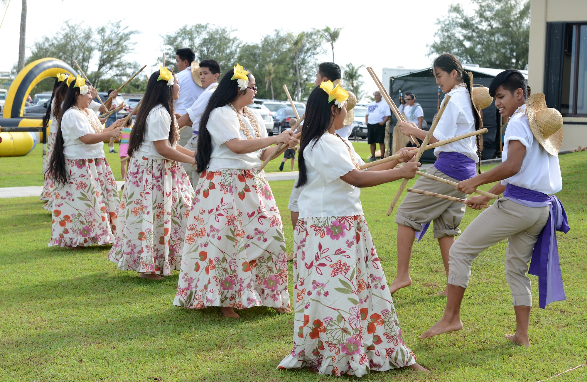 The Guma' Rason Achot Latte dance group performs during the Labor Day Bash Sept. 4, 2015, on Andersen Air Force Base, Guam. The event included family friendly activities such as rock wall climbing, zip lining, carabao rides, dance-off contests and a Mockingbird Sun concert at the end. (U.S. Air Force photo by Airman 1st Class Arielle Vasquez/Released)