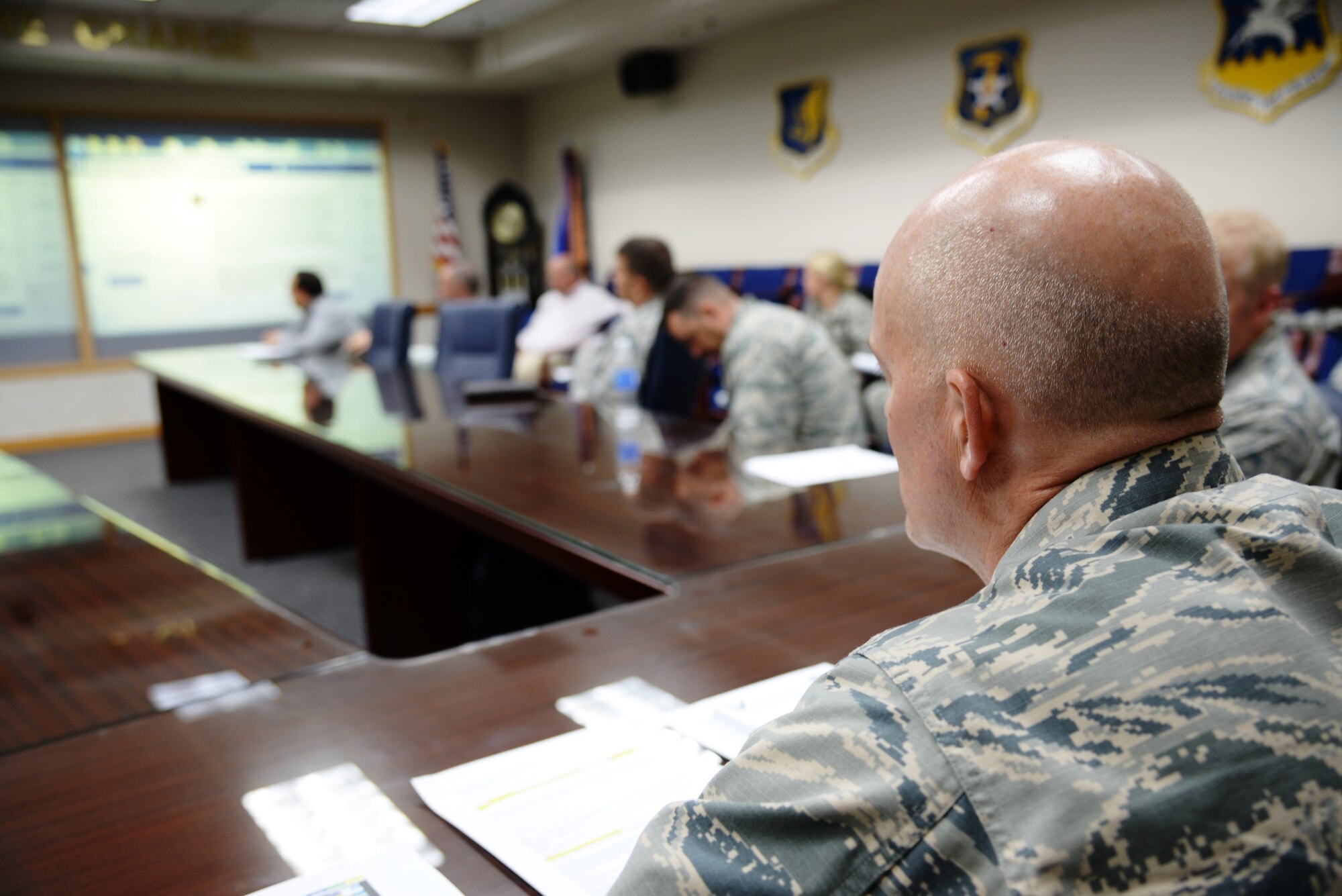 Col. Andrew Hansen, 51st Fighter Wing commander, reviews questions from members of Team Osan during a live ask me anything style town hall Sept. 1, 2015, at Osan Air Base, Republic of Korea. Hansen, or Mustang 1, took nearly 20 questions ranging from quality-of-life issues to the future of fast food here. (U.S. Air Force photo/Tech. Sgt. Travis Edwards)