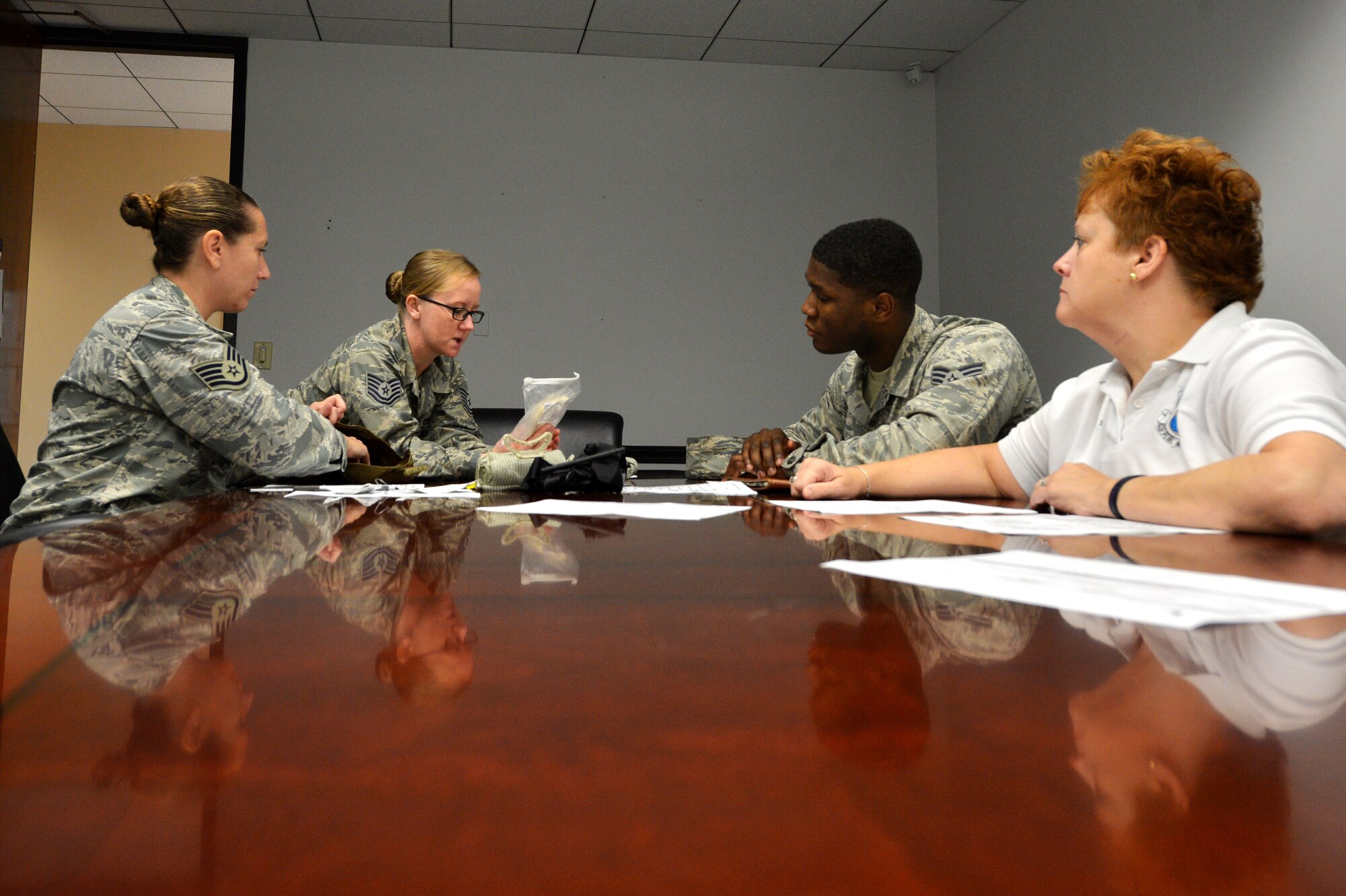 Team Shaw members go through a first aid kit during a self-aid and buddy care class at Shaw Air Force Base, S.C., Sept. 3, 2015. Members of the 20th Fighter Wing are required to complete an SABC class to keep training and requirements up to date so they are able to deploy at a moments notice. (U.S. Air Force photo by Senior Airman Diana M. Cossaboom/Released)