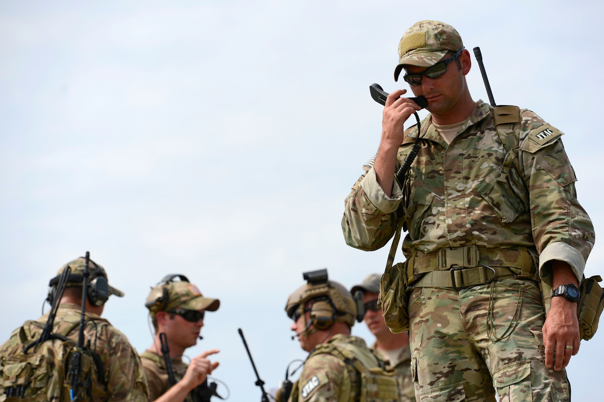 A U.S. Army joint terminal attack controller assigned to the U.S. Army Special Operations Command, calls in close air support during training at Poinsett Electronic Combat Range in Wedgefield, S.C., Sept. 1, 2015. The 55th Fighter Squadron assigned to Shaw Air Force Base, S.C., flew F-16CM Fighting Falcons to support both Air Force and Army training requirements. (U.S. Air Force photo by Senior Airman Jensen Stidham/Released)