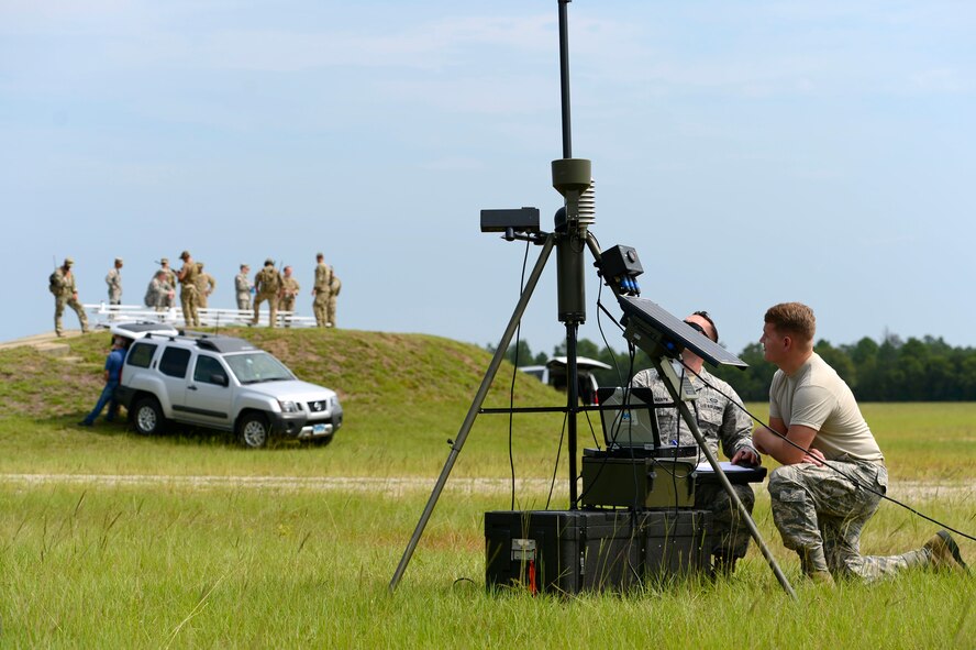 U.S. Air Force 1st Lt. Derek Romanyk, 20th Operations Support Squadron wing weather officer and Senior Airman Koletyn Jones, 20th OSS weather forecaster, take readings on a tactical weather sensor at Poinsett Electronic Combat Range, Wedgefield, S.C., Sept. 3, 2015. The weather is provided to joint terminal attack controllers approximately 10 minutes ahead of preparing coordinates to call in air strikes. (U.S. Air Force photo by Senior Airman Jensen Stidham/Released)