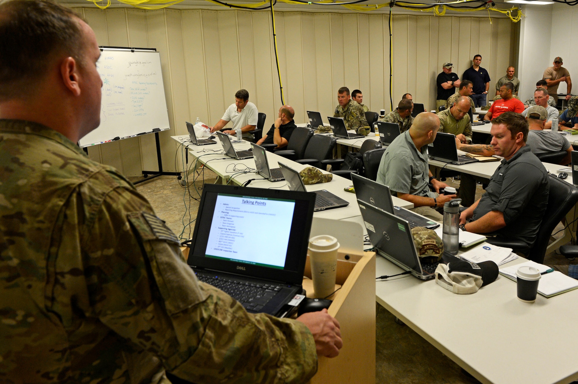 U.S. Army joint terminal attack controllers, assigned to the U.S. Army Special Operations Command, conduct a JTAC training brief at Shaw Air Force Base, S.C., Sept. 3, 2015. The previous day’s training, as well as the daily mission brief, was given to the soldiers and exercise players from the 20th Fighter Wing to ensure the safety and quality of training. (U.S. Air Force photo by Senior Airman Jensen Stidham/Released)