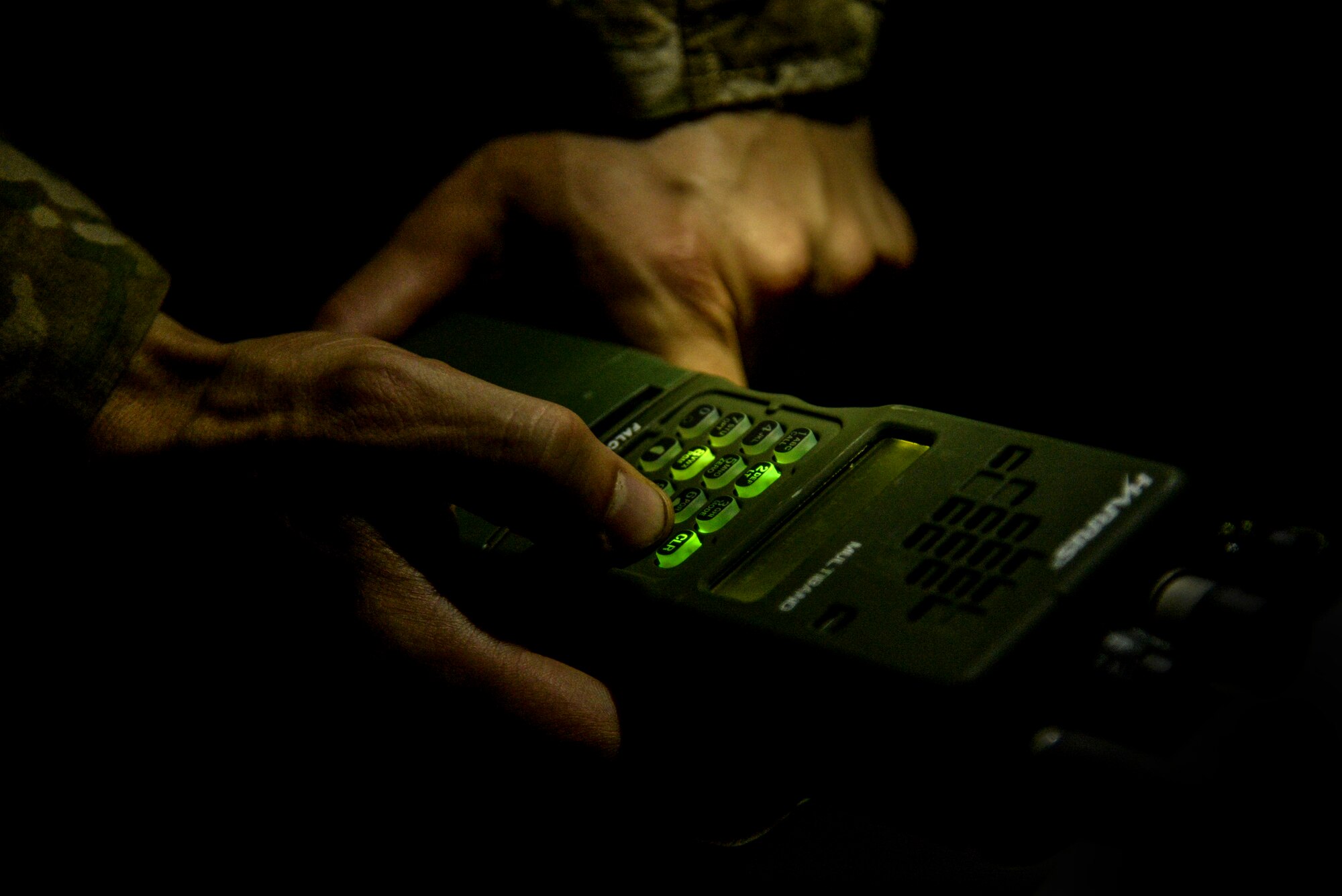 An Airman from the 633rd Civil Engineer Squadron, Joint Base Langley-Eustis, Virginia, explosive ordnance disposal flight programs the frequency of a radio as part of Operation Llama Fury, Aug. 27, 2015, at Seymour Johnson Air Force Base, North Carolina. EOD teams use radios to communicate with other units and combat operation centers to relay vital information about threats downrange. (U.S. Air Force photo/Senior Airman Brittain Crolley)