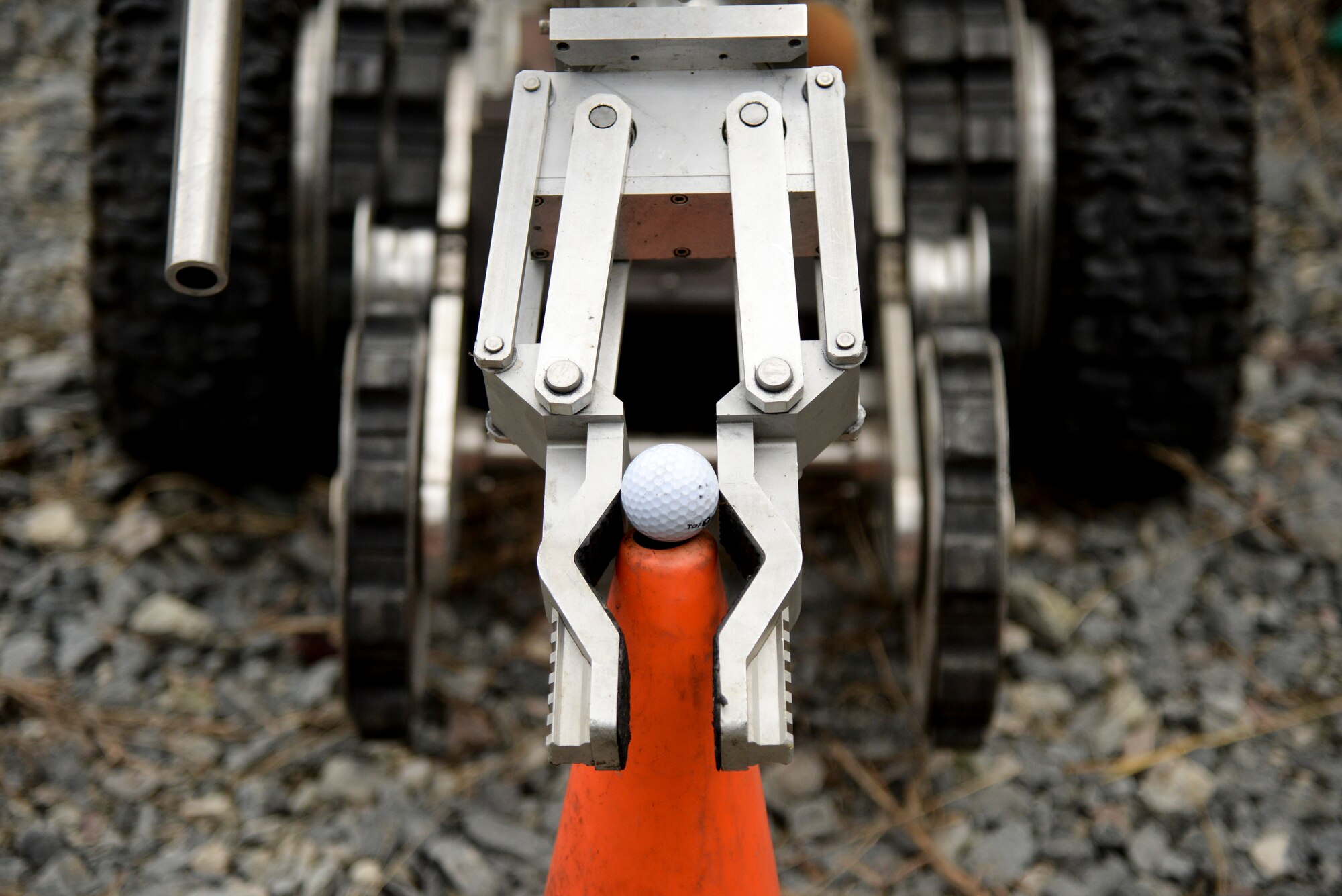 Members of the 11th Civil Engineer Squadron, Joint Base Andrews, Maryland, explosive ordnance disposal flight remotely navigate a robot through an obstacle course as part of Operation Llama Fury, Aug. 27, 2015, at Seymour Johnson Air Force Base, North Carolina. The teams competed to see who could traverse the course the fastest while also accomplishing several tasks, including moving a golf ball from one pylon to another, climbing over hurdles, and positioning a munition upright. (U.S. Air Force photo/Senior Airman Brittain Crolley)