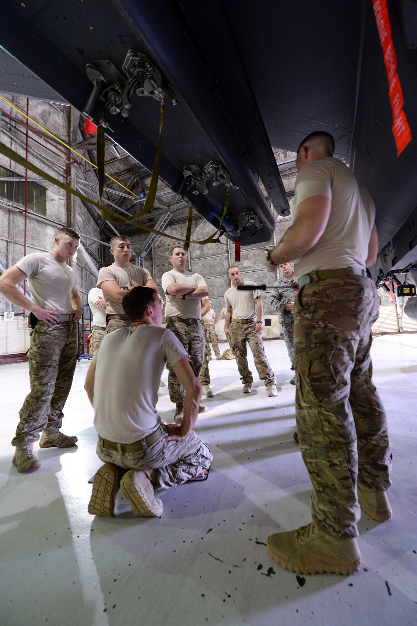 Airmen from the 4th Civil Engineer Squadron explosive ordnance disposal flight familiarize EOD technicians from other bases with the F-15E Strike Eagle as part of Operation Llama Fury, Aug. 24, 2015, at Seymour Johnson Air Force Base, North Carolina. When EOD technicians are sourced for a deployment, they are often tasked to respond to aircraft emergencies for aircraft they don’t normally see at home station. (U.S. Air Force photo/Senior Airman Brittain Crolley)