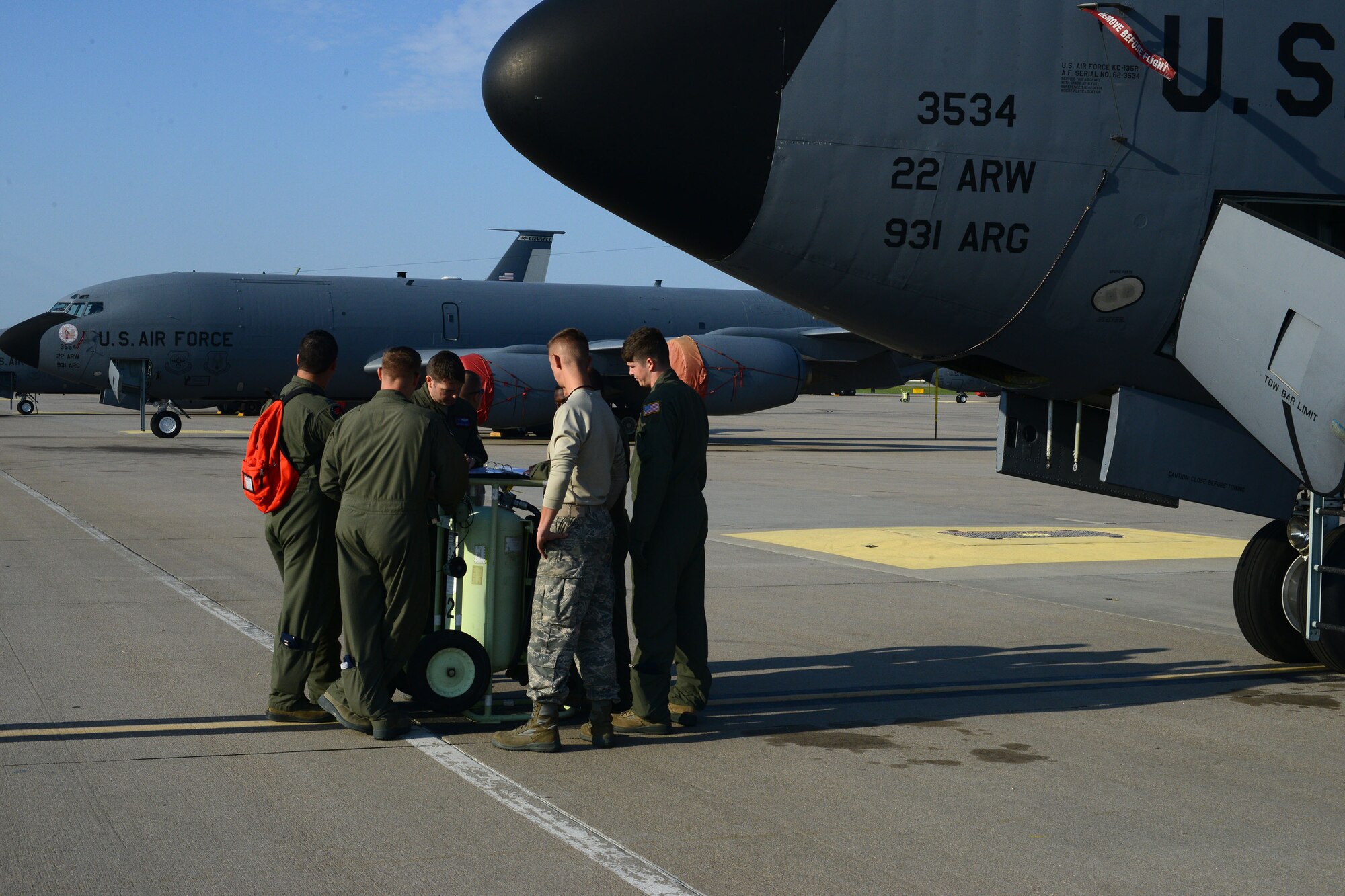 The aircrew of a KC-135 Stratotanker review a pre-flight checklist with maintenance personnel before a training exercise, Sept. 2, 2015, at McConnell Air Force Base, Kansas. The KC-135 enables American and allied aircraft a potentially endless range, limited only by pilot duration and skill. (U.S. Air Force Photo by Airman Jenna K. Caldwell)