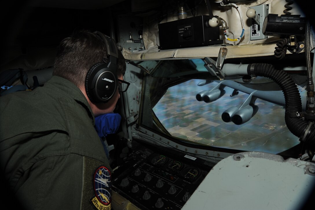 Airman 1st Class Joseph Cadwallader, 349th Air Refueling Squadron boom operator, refuels a B-52 Stratofortress, Sept. 2, 2015, over Kansas. The KC-135 has been in service since the 1950s, and was originally designed to be able to keep up with modern, jet engine-powered aircraft like the B-52. The KC-135 is assigned to the 22nd Air Refueling Wing at McConnell Air Force Base, Kan., and the B-52 is assigned to the 2nd Bomb Wing at Barksdale AFB, La. (U.S. Air Force Photo by Airman Jenna K. Caldwell)