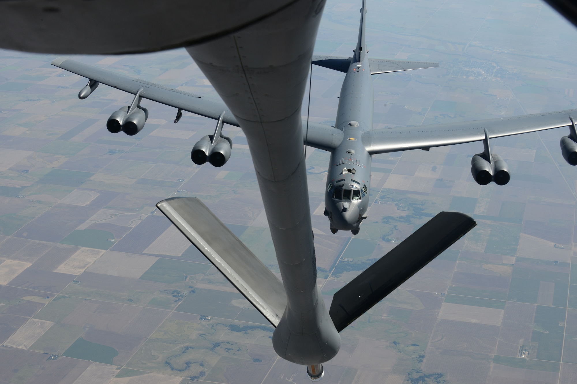 A B-52 Stratofortress approaches a KC-135 Stratotanker for an aerial refueling training mission, Sept. 2, 2015, over Kansas. The KC-135 has been providing American and allied forces aerial refueling capabilities since the 1950s. The B-52 is assigned to the 2nd Bomb Wing at Barksdale Air Force Base, La., and the KC-135 is assigned to the 22nd Air Refueling Wing stationed at McConnell AFB, Kan. (U.S. Air Force Photo by Airman Jenna K. Caldwell)