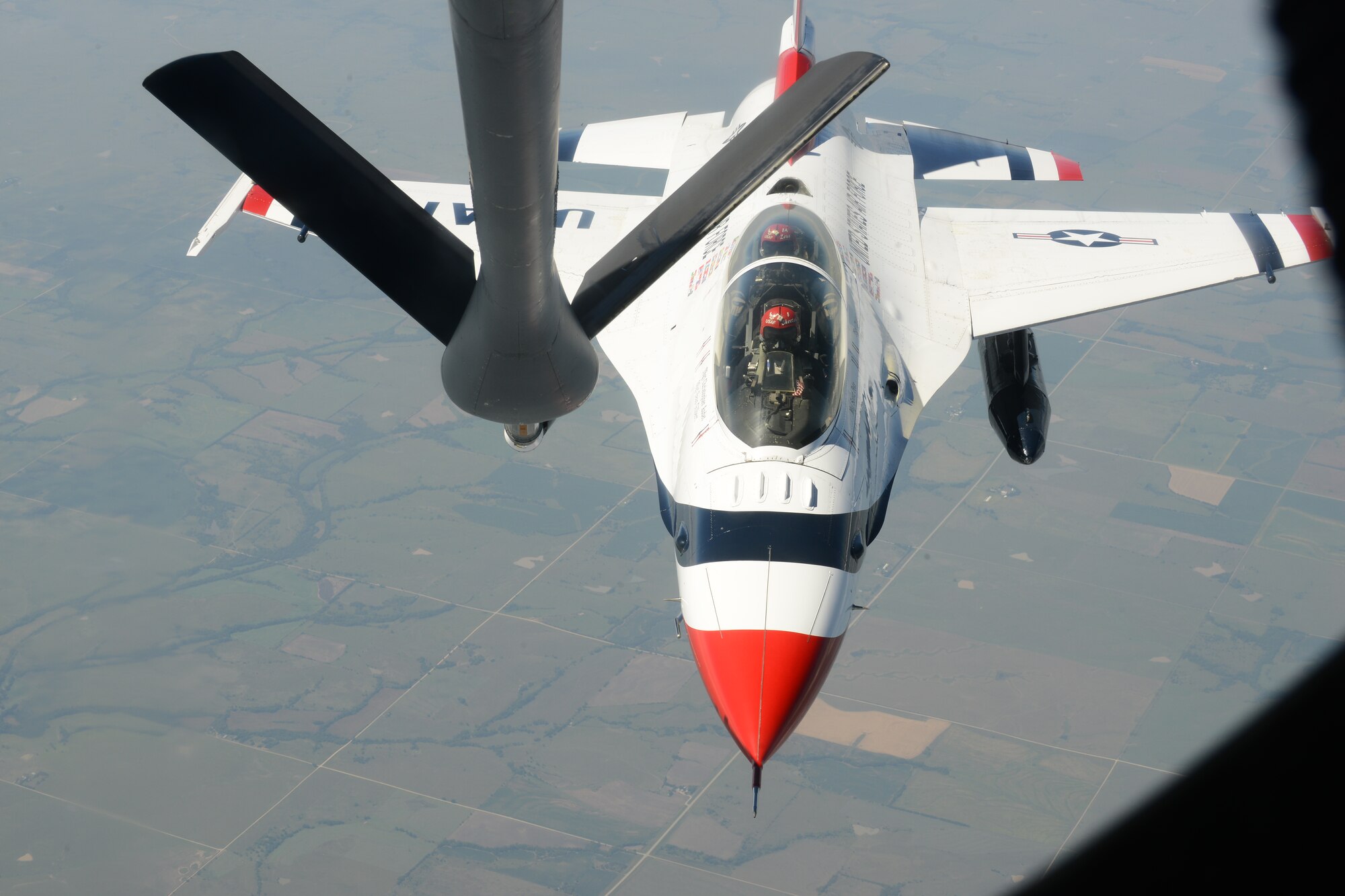 U.S. Air Force Thunderbirds, an F-16 Fighting Falcon approaches a KC-135 Stratotanker for refueling Sept. 2, 2015, over Kansas. The Thunderbirds are the premiere air demonstration team for the U.S. Air Force, and perform aerobatic formations and stunts for crowds at airshows worldwide.  The KC-135 is with the 22nd Air Refueling Wing stationed at McConnell AFB, Kan. (U.S. Air Force Photo by Airman Jenna K. Caldwell)