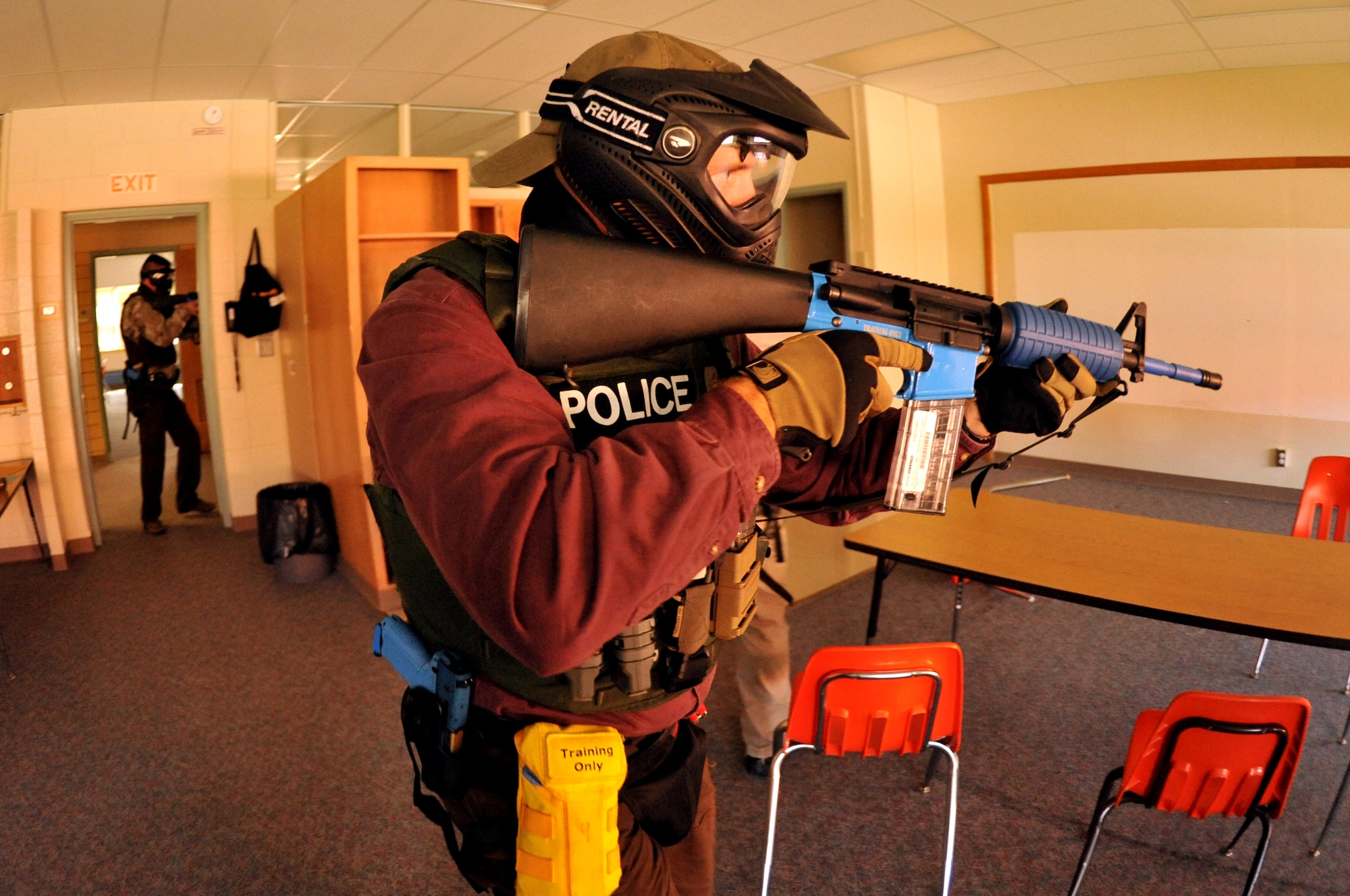 Police officers practice room clearing procedures during a training scenario Sept. 3, 2015 at Carl Ben Eielson Elementary School on Grand Forks Air Force Base, North Dakota. Nearly two dozen law enforcement officers from various agencies across the region came together here during the first week of September 2015 for some classroom and hands-on training dealing with a variety of active shooter scenarios. (U.S. Air Force photo/Staff Sgt. Susan L. Davis)