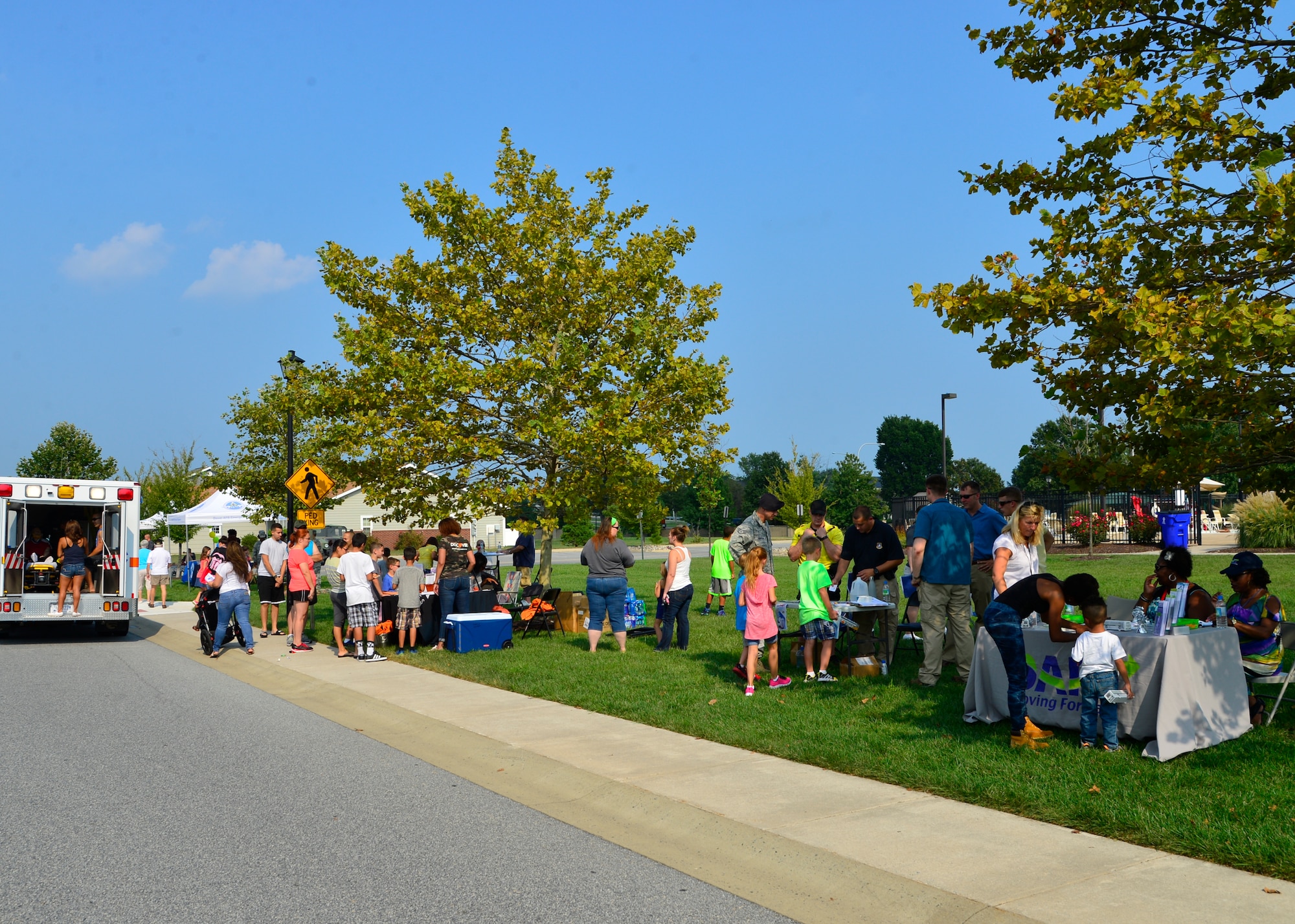Team Dover families attend the Emergency Preparedness Block Party hosted by the 436th Civil Engineer Squadron Emergency Management Sept. 3, 2015, on base housing at Dover Air Force Base, Del. September is National Preparedness Month and families were taught by experts what to do in the event of a real life emergency. (U.S. Air Force photo/Airman 1st Class William Johnson)