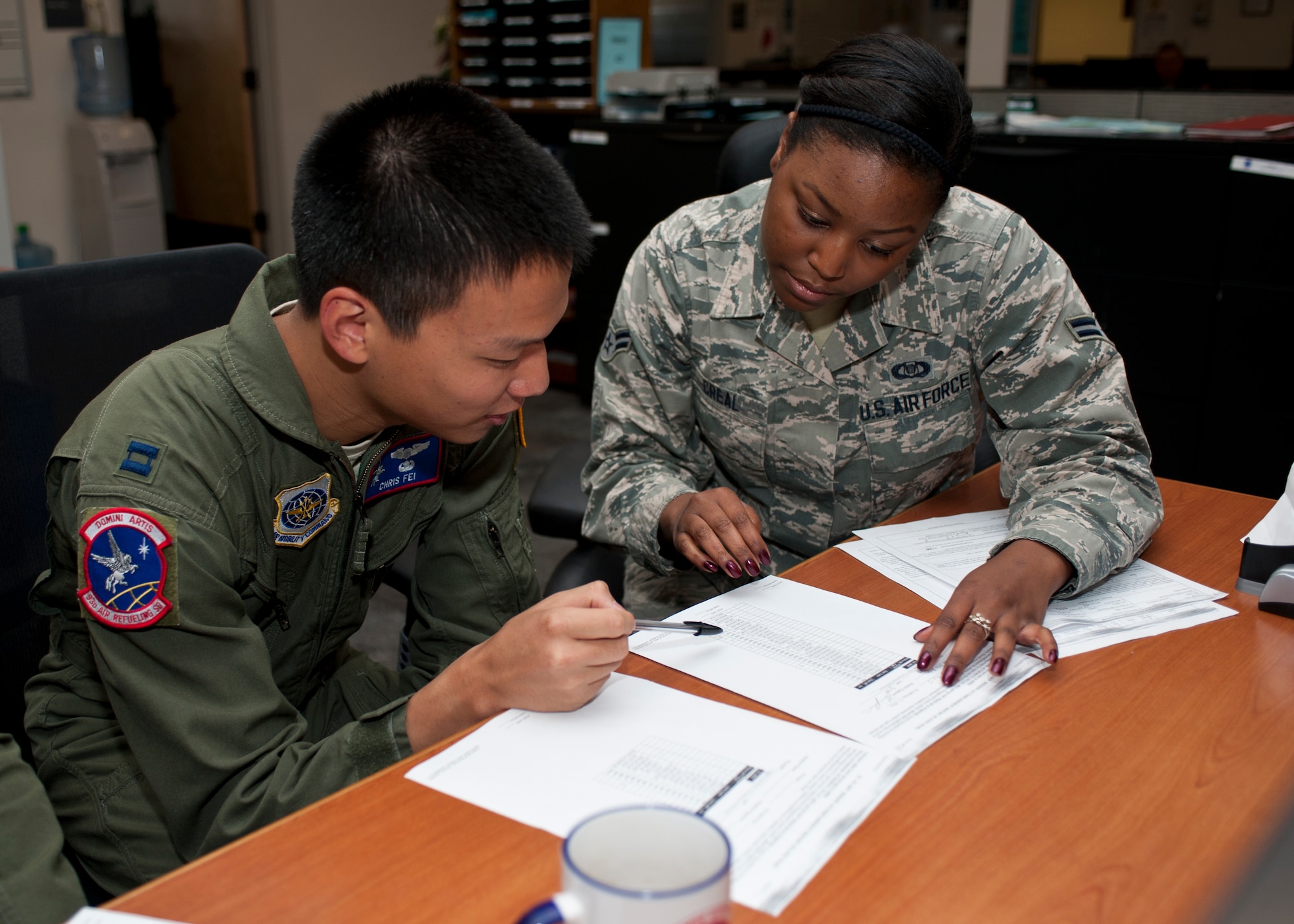 Airman 1st Class Joy Creal, 93rd Air Refueling Squadron aviation resource manager, goes over papers with Captain Chris Fei, 93rd ARS executive officer Sept. 3, 2015, at Fairchild Air, Force Base Wash. Creal keeps track of aircrew member training and ensures that aircrew are qualified to perform their duties. Her leadership selected her as one of Fairchild’s Finest, a weekly recognition program that highlights top-performing Airmen. (U.S. Air Force photo/Airman Sean Campbell)