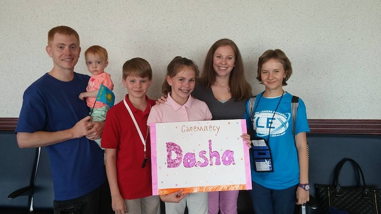 Greg (left), Aerobella, Nathan, Lily and Roze Sharp welcome Darya (Dasha) Likhacheva to America Thursday, Aug. 20, 2015, in the Colorado Springs Airport terminal. The Sharp family is hosting Likhacheva for the school year through the American Councils for International Education exchange program. (Photo courtesy/Roze Sharp)