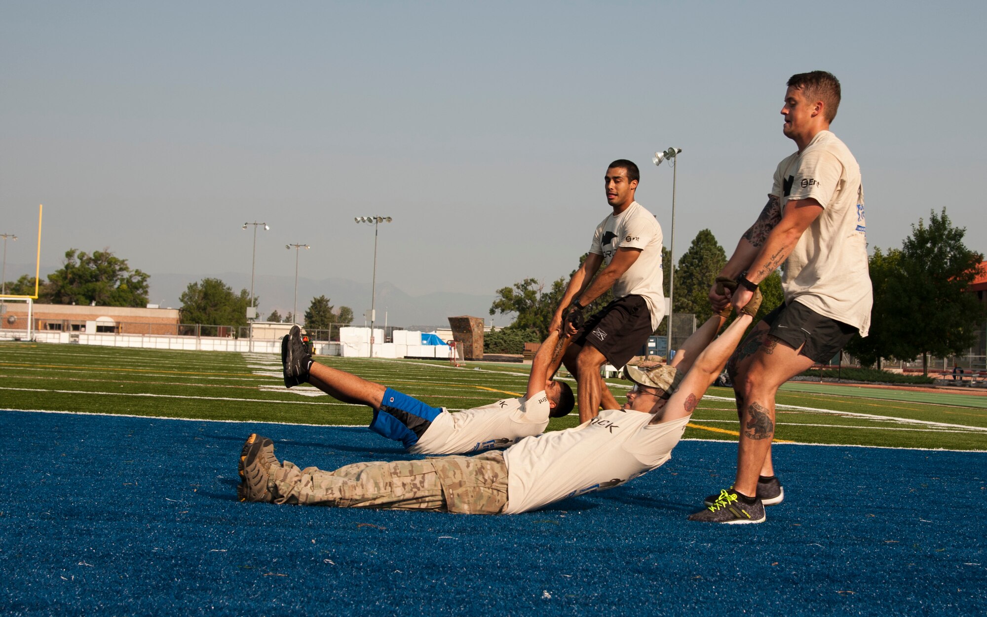 PETERSON AIR FORCE BASE, Colo. – Participants in the Team Cohesion Challenge complete a series of intense exercises over five hours and 7-10 miles Aug. 29, 2015. The free event is led by Special Operations Cadre with the goal of building a team through various obstacles designed to push them physically and mentally. (U.S. Air Force photo by Senior Airman Tiffany DeNault)