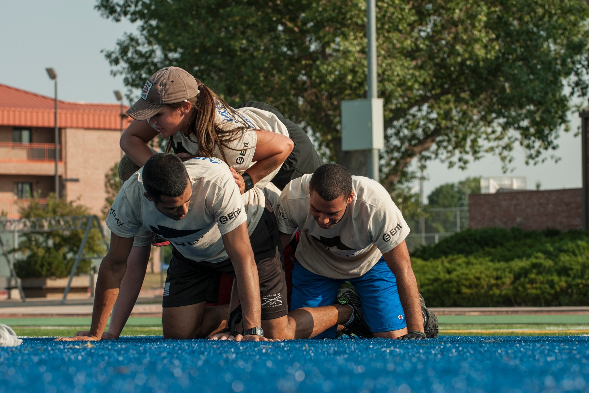 PETERSON AIR FORCE BASE, Colo. – Peterson Airmen move slowly to keep one participant stable on top the rest while participating in the Team Cohesion Challenge at the base Fitness Center, Aug. 29, 2015.  The tasks given to Airmen could not be completed individually and required concentration and teamwork. (U.S. Air Force photo by Airman 1st Class Rose Gudex)