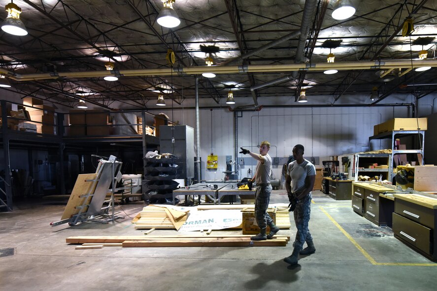 Senior Airmen Matthew Doble, left, and Lagarrick Gantt, 341st Logistics Readiness Squadron packing and crating journeymen, gather material to build a crate for shipping Aug. 2, 2015, at Malmstrom Air Force Base, Mont. The 341st LRS packing and crating shop ensures the successful transit and delivery of various parts and equipment worldwide. (U.S. Air Force photo/Chris Willis)