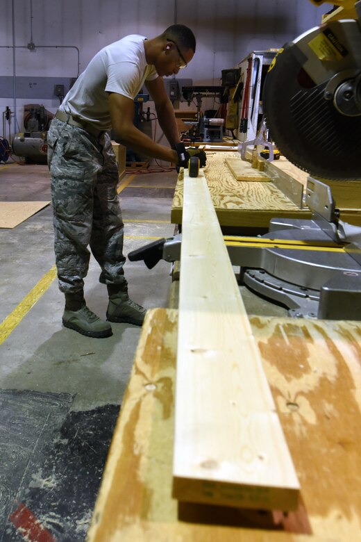 Senior Airman Lagarrick Gantt, 341st Logistics Readiness Squadron packing and crating journeyman, builds a crate for shipping Aug. 2, 2015, at Malmstrom Air Force Base, Mont. The packaging and crating shop has a team of five personnel pushing out 20 to 30 crates a month and up to 20 pieces of equipment daily. (U.S. Air Force photo/Chris Willis)