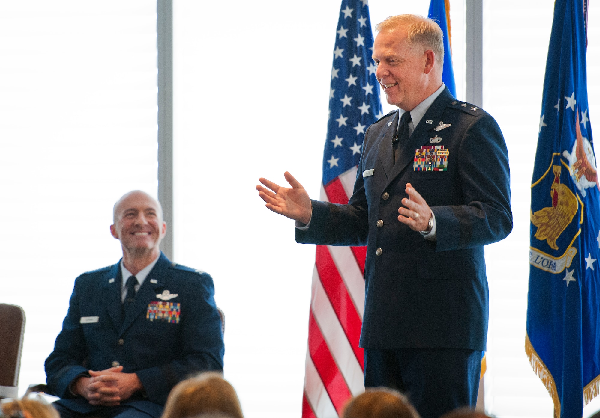 Former 96th Test Wing commander, Maj. Gen. David Harris, jokes about his replacement and newly promoted, Brig. Gen. Christopher Azzano Sept. 2 at Eglin Air Force Base, Fla.  Harris, the Air Force Test Center commander, officiated the promotion ceremony for Azzano. (U.S. Air Force photo/Samuel King Jr.)