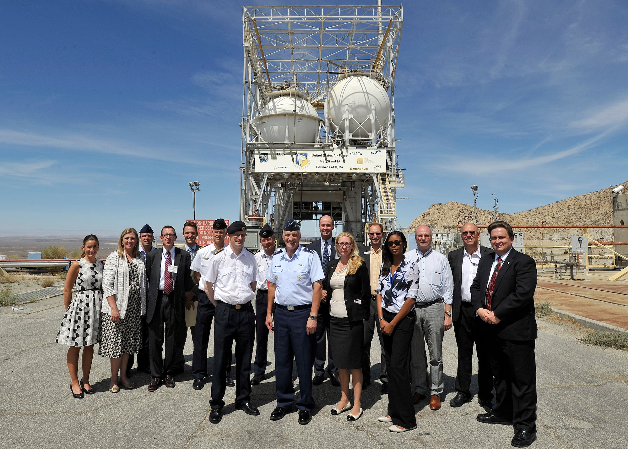Center: Maj. Gen. Thomas Masiello, Air Force Research Laboratory commander, and to his left, Sweden Brig. Gen. John Stjernfalk, Swedish Air & Space Procurement director, pose for a photo with other Swedish delegates and AFRL Detachment 7 staff in front of Test Stand 1A on Edwards Air Force Base. (U.S. Air Force photo by Ron Fair)

