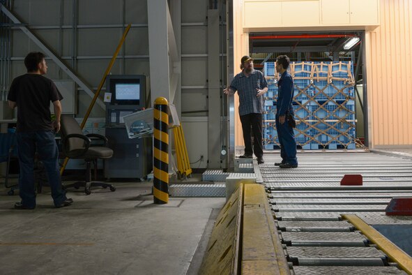 A bundle rigged by Japan Air Self-Defense Force members processes through the mechanized materiel handling system during 2015 Pacific Agility Logistics and Safety Symposium at Yokota Air Base, Japan, Sept. 2, 2015. The symposium is a Pacific Command initiative aimed at increasing interoperability between regional partners. It allowed the multinational participants to discuss and learn innovative safety, supply and maintenance standards. (U.S. Air Force photo by Staff Sgt. Cody H. Ramirez/Released)