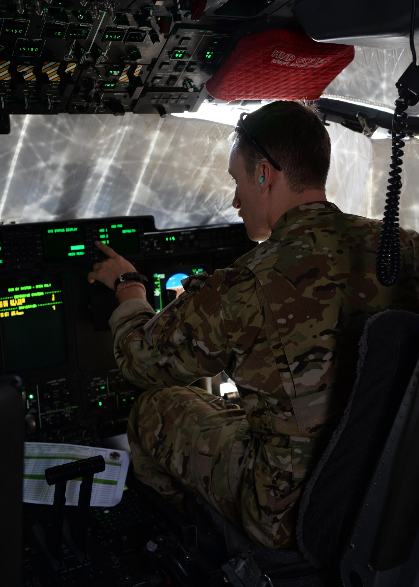 U.S. Air Force Capt. Matt Buchholtz, 774th Expeditionary Airlift Squadron C-130J Super Hercules pilot, turns on controls before getting ready for take-off Sep. 3, 2015, at Bagram Airfield, Afghanistan. Buchholtz and his team, who are deployed from Little Rock Air Force Base, Arkansas, fly various combat missions throughout Afghanistan supporting missions ranging from medical evacuations to cargo and passenger transports. (U.S. Air Force photo by Senior Airman Cierra Presentado/Released)
