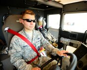 U.S. Air Force Senior Airman Zach White, 332nd Expeditionary Civil Engineer Squadron firetruck engineer and driver operator, drives a fire truck at an undisclosed location in Southwest Asia, Aug. 20, 2015.  Being a fire protection specialist, White is knowledgeable in the principles and operations of fighting building, aircraft, hazardous materials, wild land and miscellaneous fires. (U.S. Air Force photo by Senior Airman Racheal E. Watson/Released)