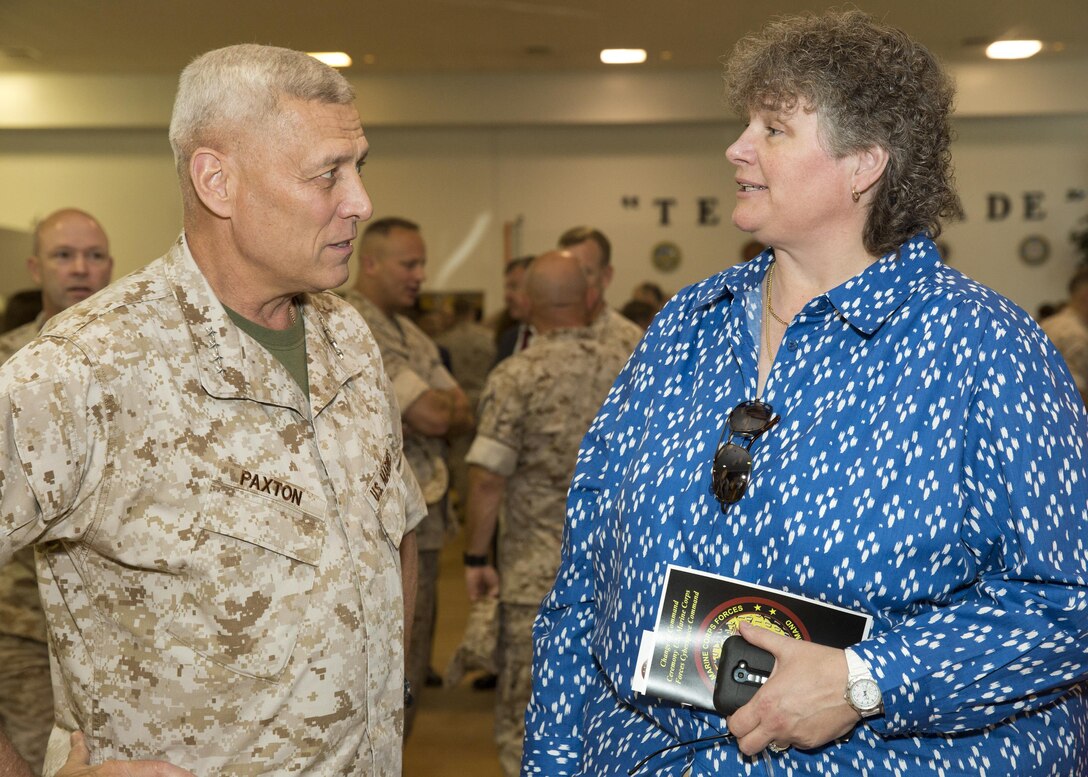 The Assistant Commandant of the U.S. Marine Corps, Gen. John M. Paxton, Jr., left, speaks with guests at the change of command ceremony for U.S. Marine Corps Forces Cyberspace Command at U.S. Army installation, Fort George G. Meade, Md., Sept. 8, 2015. (U.S. Marine Corps photo by Sgt. Tia Dufour/Released)