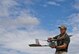 Staff Sgt. Leland Hastings, 919th Special Operations Security Forces Squadron, prepares to launch the Raven-B, a four-by-four foot unmanned aerial system, into the skies above Camp Guernsey, Wyo., Aug. 4.  The 919th SOSFS brought the UAS to demonstrate its capabilities to other security forces units involved in a large field training exercise at the camp. The Raven-B has the ability to take photos, video in day or night, and even designate locations via an IR laser.  It also provides coordinates, magnetic azimuths, and linear distances creating a birds-eye view to topographical map. (U.S. Air Force photo/Tech. Sgt. Sam King)