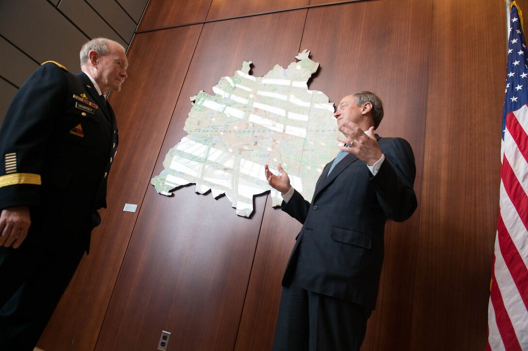 U.S. Army Gen. Martin E. Dempsey, left, chairman of the Joint Chiefs of Staff, meets with U.S. Ambassador to Germany John Emerson at the U.S. Embassy in Berlin, Sept. 9, 2015. DoD photo by D. Myles Cullen