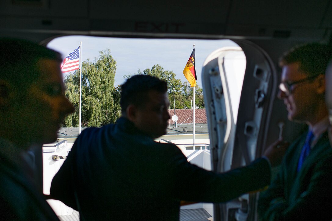 U.S. Air Force aircrew members open the door of a C-32 aircraft upon arriving in Berlin, Sept. 9, 2015. U.S. Army Gen. Martin E. Dempsey, chairman of the Joint Chiefs of Staff, traveled to Germany to meet with his German counterpart and discuss their nations' military-to-military relationships. DoD photo by D. Myles Cullen