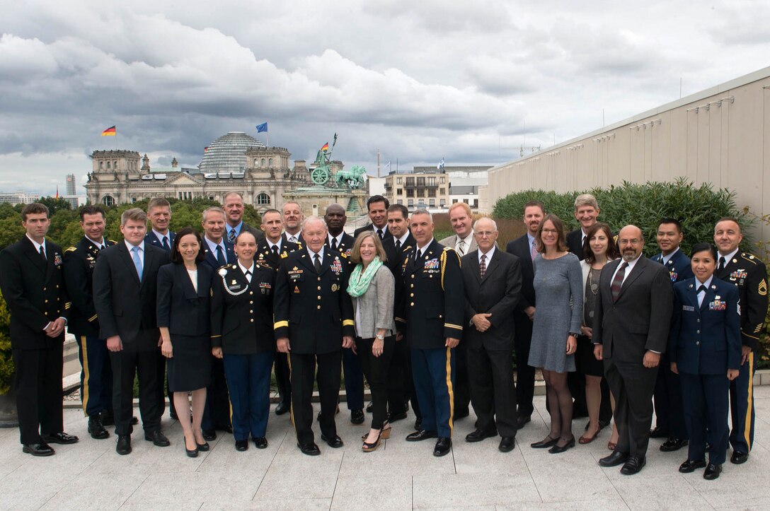 U.S. Army Gen. Martin E. Dempsey, chairman of the Joint Chiefs of Staff, stands for a photo with U.S. State Department and military personnel while visiting the U.S. Embassy in Berlin, Sept. 9, 2015. DoD photo by D. Myles Cullen