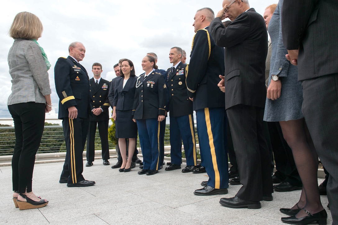 U.S. Army Gen. Martin E. Dempsey, second from left, chairman of the Joint Chiefs of Staff, talks with U.S. State Department and military personnel while visiting the U.S. Embassy in Berlin, Sept. 9, 2015. DoD photo by D. Myles Cullen