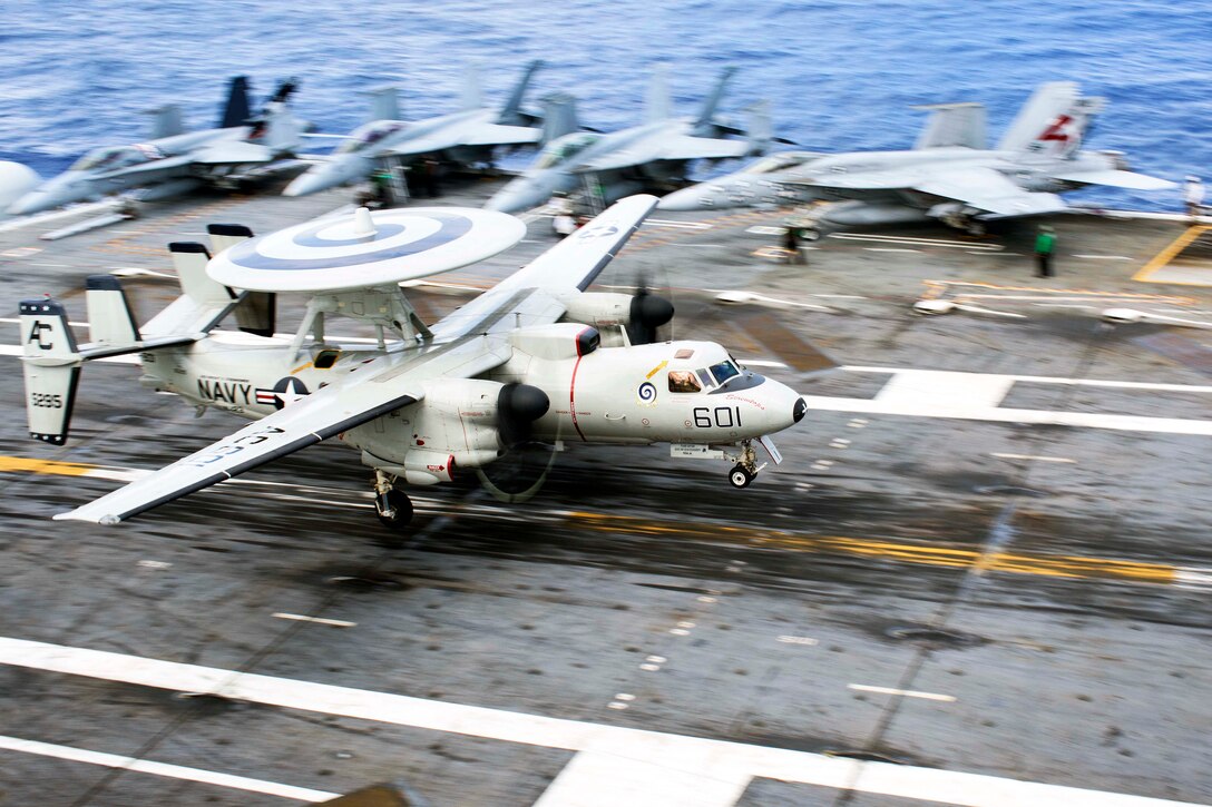 An E-2C Hawkeye lands on the flight deck of the aircraft carrier USS Dwight D. Eisenhower in the Atlantic Ocean, Sept. 7, 2015. The Dwight D. Eisenhower is underway conducting flight deck certifications. U.S. Navy photo by Petty Officer 3rd Class Theodore Quintana