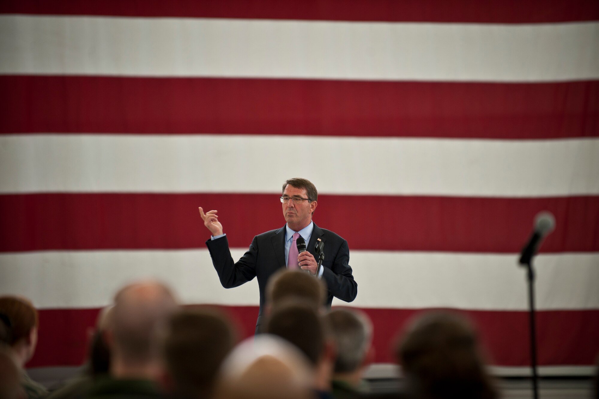Defense Secretary Ash Carter addresses Airmen and coalition partners during an all call at Nellis Air Force Base, Nev., Aug. 26, 2015. During the secretary’s visit to Nellis AFB he observed Red Flag 15-4 operations and spoke to Airmen and coalition partners. During the all call, Carter took questions from service members and addressed issues relating to budgets, force retention, morale and operational priorities. (U.S. Air Force photo/Senior Airman Joshua Kleinholz)