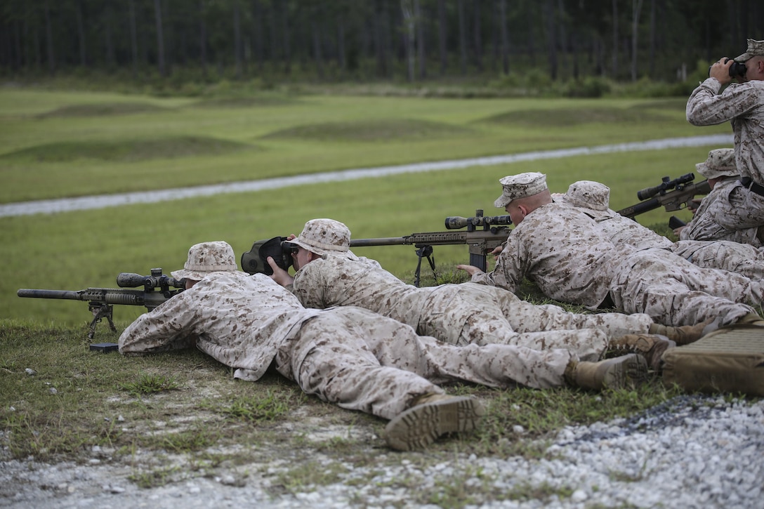 Marines with Sniper Platoon, Weapons Company, 2nd Battalion, 6th Marine Regiment, take aim on targets during a weapons zeroing range at G21, Camp Lejeune, N.C., Sept. 3, 2015. Shooters and spotters worked together to accurately engage targets. (U.S. Marine Corps photo by Cpl. Paul S. Martinez/Released)