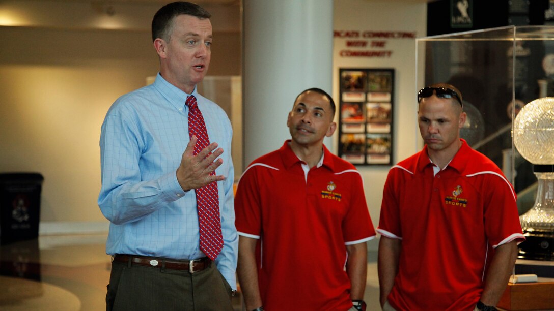 Greg Burns, the Athletic director of the University of Arizona, speaks to the All-Marine soccer team during their tour of the University of Arizona’s sports facilities in Tucson, Arizona., Sept. 9, 2015. The Marines visited the stadiums and training areas, and the Jim Click Hall of Champions filled with items immortalizing the history of the University of Arizona Wildcats.