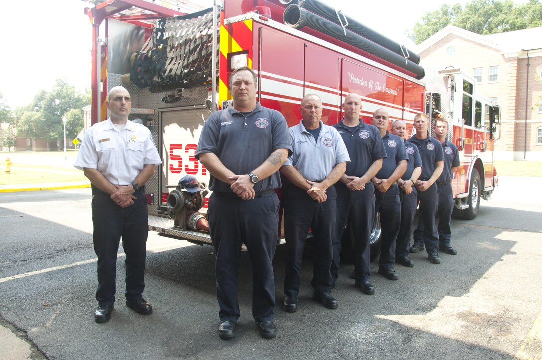 From left: Dwayne Palermo, of Stafford, Va., Paul Pandolfi, of Manassas, Va., David Williams, of Spotsylvania, Va., Don Perry, of Stafford, Va., Charles McMahon, of Woodbridge, Va., Jimmy Thacker, of Stafford, Va., Aaron Darley, of Cordova, Ala., and Robert Starge of Pensacola, Fla., (Not photographed: Cliff Burton, of Stafford, Va., and Charles Stevens, of Spotsylvania, Va.)  form the Marine Corps Base Quantico Mainside Station 531 Fire and Rescue team who responded to the second-floor apartment fire on 204 Broadway St. in the Town of Quantico, Aug. 20. At approximately 7:25 a.m. the firemen were the first responders to the fire, where they recovered four individuals. The fire started on the second floor of a bedridden elderly man. Preliminary reports indicate that there were many who fled the fire by foot. Once the fire was extinguished, the firemen recovered Frank Anthony DeSanto, age 69, and first responders pronounced him dead on the scene.