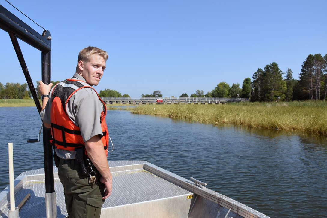 Gus Garbe, park ranger at Leech Lake, Federal Dam, Minn., stands by to adjust a no wake zone buoy that's out of place Sept. 3, 2015. The buoys, which are anchored with a block of concrete, need to be adjusted periodically throughout the recreation season. All buoys are removed prior to the lake freezing and cleaned or repaired during the off-season.