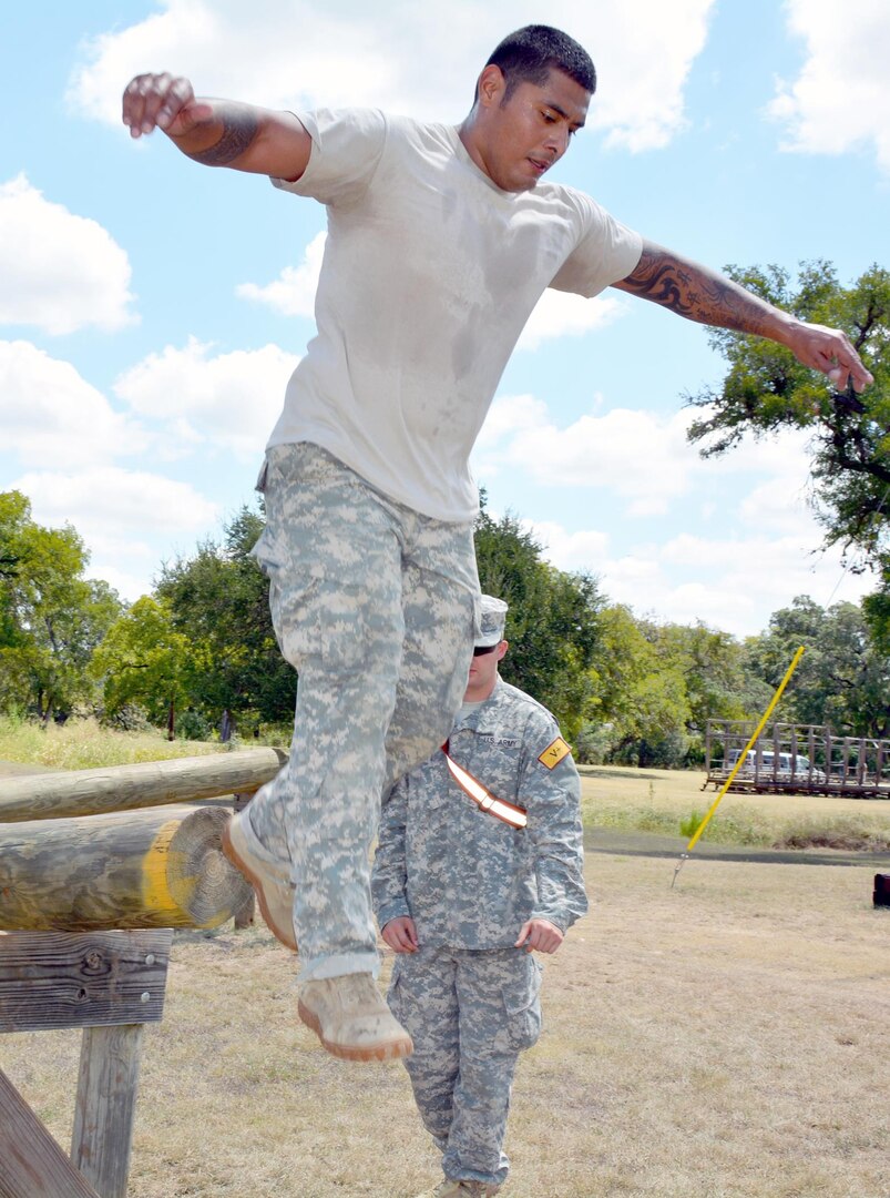 Sgt. 1st Class Steven Sic, Academy Brigade, U.S. Army Medical Department Center and School, U.S. Army Health Readiness Center of Excellence, jumps off a balancing log during the 2015 AMEDDC&S, HRCoE Best Medic competition at Camp Bullis Sept 2.