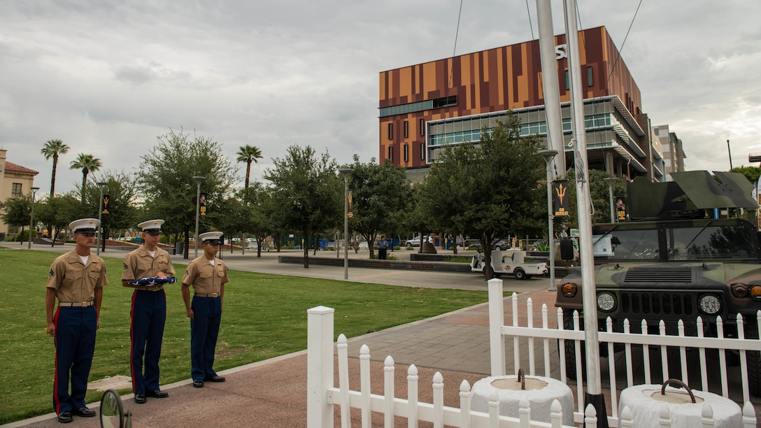 A Marine Corps color guard prepares to raise the colors at Civic Space Park on Sept. 9, 2015 as part of Marine Week Phoenix. This event allows the Marine Corps to showcase its traditions, history, and values.
