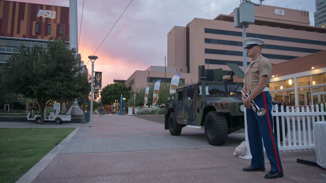 Cpl. Drew Blincoe takes his position at the center of Civic Space Park in Phoenix, Sept. 9, 2015, before sounding reveille as part of Marine Week Phoenix. Marine Week Phoenix gives the people of Phoenix an opportunity to see Marine Corps history, traditions, and values.