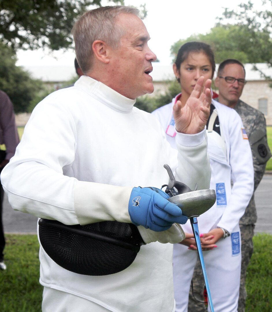 John Moreau, University of the Incarnate Word fencing coach, explains the modern pentathlon’s fencing competition to Fort Sam Houston personnel in the Quadrangle Sept. 2. Moreau, a former Olympian and current modern pentathlon judge, is helping Fort Sam Soldiers train to be pentathletes.