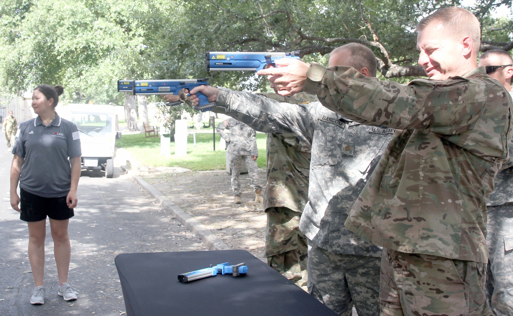 Soldiers participate in a laser pistol demonstration at the Army North Brigade Health Promotion meeting at the Quadrangle Sept. 2. The laser pistol is a part of the run and shoot event of the modern pentathlon. 