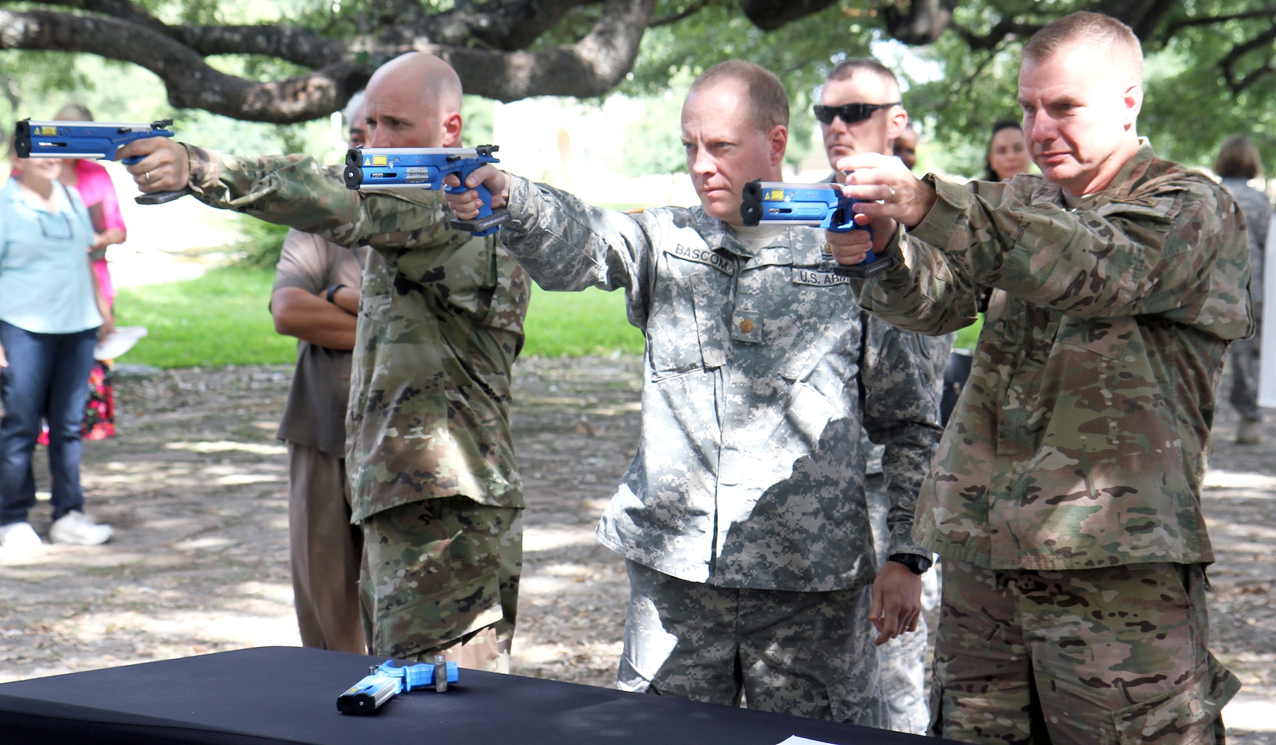 Soldiers participate in a laser pistol demonstration at the Army North Brigade Health Promotion meeting at the Quadrangle Sept. 2. The laser pistol is a part of the run and shoot event of the modern pentathlon. 