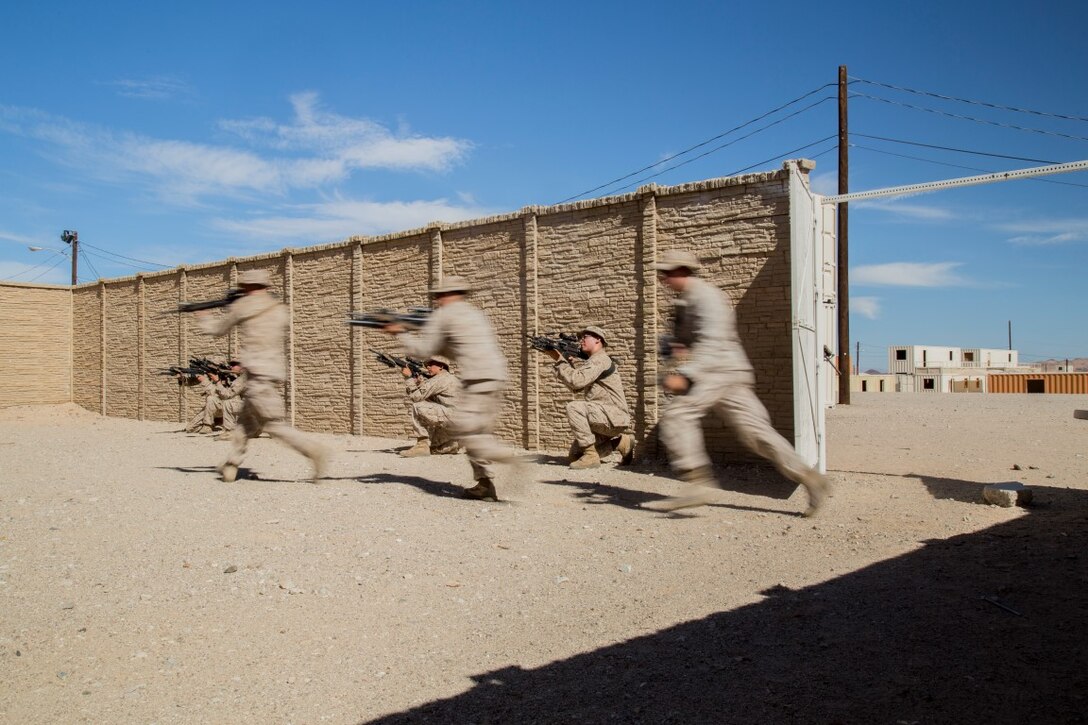 Marines with Company “F”, 2nd Battalion, 1st Marine Regiment, practice breaching and room clearing during Realistic Urban Training Exercise (RUTEX) at range 215 aboard Marine Corps Air Ground Combat Center Twentynine Palms, Calif., Aug. 31, 2015. RUTEX provides Marines and Sailors of the 13th Marine Expeditionary Unit (13th MEU) an opportunity to perform and practice their duties while deployed in an urban environment.(U.S. Marine Corps photo by Sgt Hector de Jesus/Released)