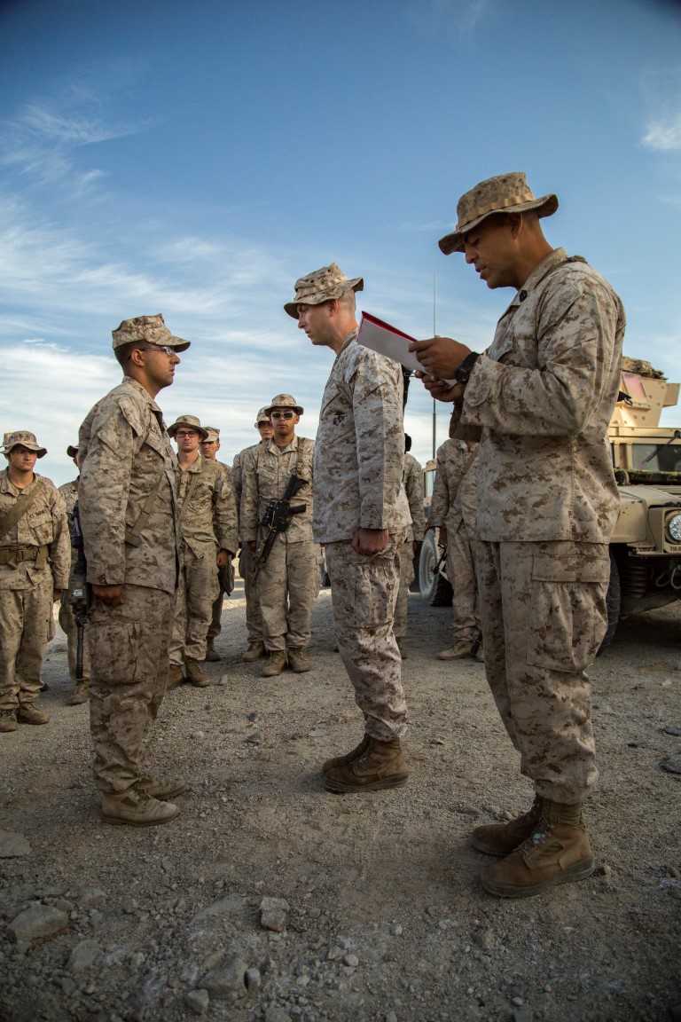 Lance Cpl Monty Legget with 2nd Battalion, 1st Marine Regiment, is promoted to the rank of Corporal during Realistic Urban Training Exercise (RUTEX) at range 210 aboard Marine Corps Air Ground Combat Center Twentynine Palms, Calif., Sept. 2, 2015. RUTEX provides Marines and Sailors of the 13th Marine Expeditionary Unit (13th MEU) an opportunity to perform and practice their duties while deployed in an urban environment.