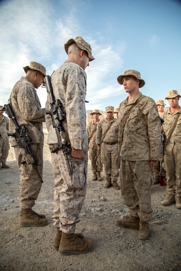 PFC Patrick Creech with 2nd Battalion, 1st Marine Regiment, is promoted to the rank of Lance Cpl during Realistic Urban Training Exercise (RUTEX) at range 210 aboard Marine Corps Air Ground Combat Center Twentynine Palms, Calif., Sept. 2, 2015. RUTEX provides Marines and Sailors of the 13th Marine Expeditionary Unit (13th MEU) an opportunity to perform and practice their duties while deployed in an urban environment.