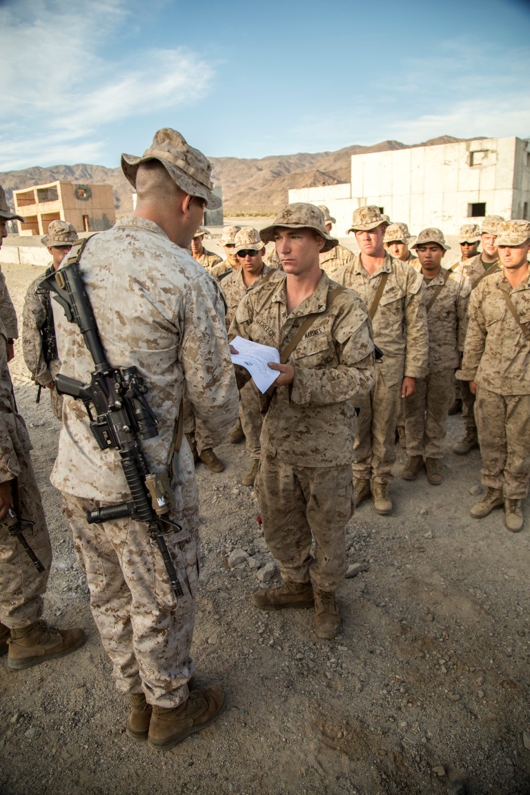 PFC Patrick Creech with 2nd Battalion, 1st Marine Regiment, is promoted to the rank of Lance Cpl during Realistic Urban Training Exercise (RUTEX) at range 210 aboard Marine Corps Air Ground Combat Center Twentynine Palms, Calif., Sept. 2, 2015. RUTEX provides Marines and Sailors of the 13th Marine Expeditionary Unit (13th MEU) an opportunity to perform and practice their duties while deployed in an urban environment.