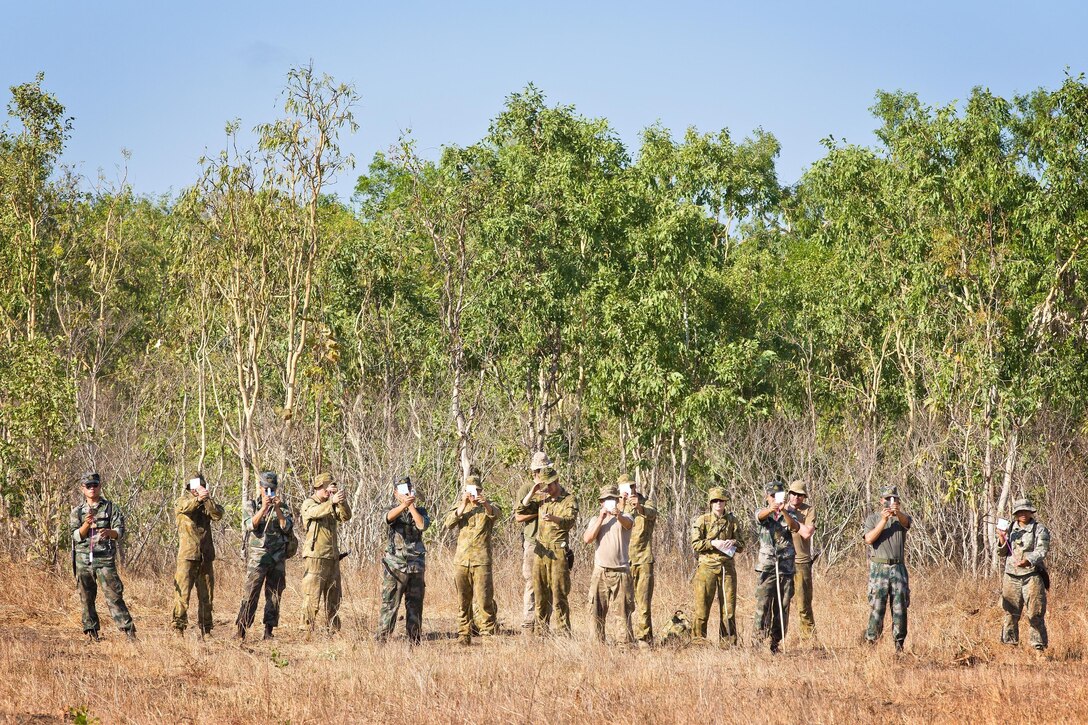 Australian Army soldiers join U.S. Marines with 1st Battalion, 4th Marine Regiment, Marine Rotational Force - Darwin, U.S. Army soldiers with the 25th Infantry Division, U.S. Army Pacific, and Chinese People's Liberation Army soldiers practicing their signal mirror skills during Exercise Kowari 2015, being conducted in the Daly River region of the Northern Territory. Kowari is a trilateral environmental survival training opportunity hosted by Australia and includes forces from Australia, China and the U.S. simultaneously. 