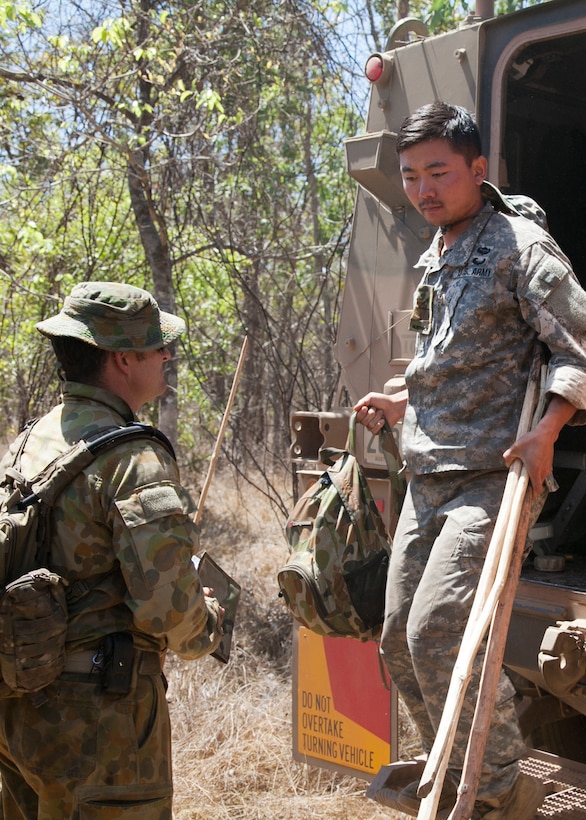 U.S. Army 2nd Lt. Jae Yu with the 25th Infantry Division, U.S. Army Pacific, steps out of an Australian protected mobility vehicle after Exercise Kowari 15 participants were relocated to their survival test location Sept. 6 in the Daly River region, Northern Territory, Australia. Kowari is a trilateral environmental survival training opportunity hosted by Australia and includes forces from Australia, China and the U.S. simultaneously. 